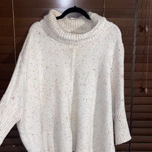 Multi color spec creme turtleneck sweater